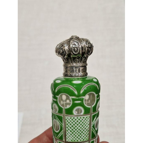 440 - Victorian green cased engraved glass scent bottle, with embossed white metal mount and original glas... 