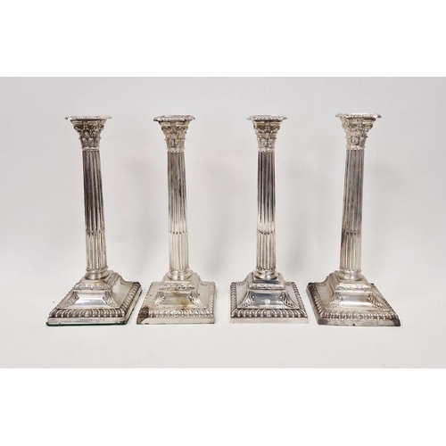 445 - Victorian set of four large silver candlesticks, of Corinthian column form, on square bases, hallmar... 