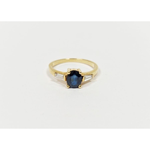 483 - 18ct yellow gold, sapphire and diamond ring set oval sapphire flanked by two tapering baguette-type ... 