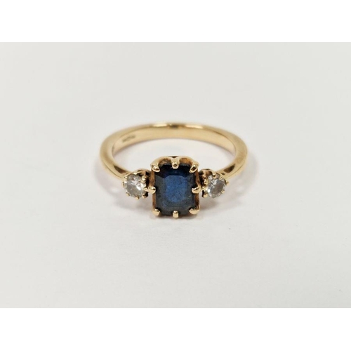 512 - 9ct gold, sapphire and diamond ring, the rectangular sapphire flanked by two claw-set diamonds