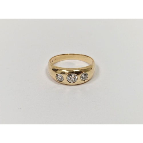 578 - Gold and three-stone diamond ring set graduated stones in rubover setting, 6g gross (the diamonds 0.... 