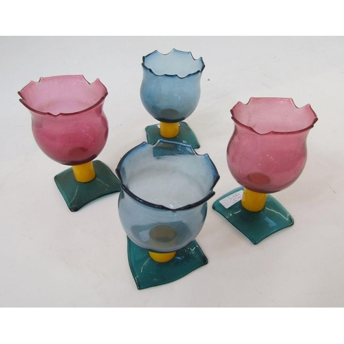 97 - Four 1990s coloured studio glass goblets and a tapering conical decanter, the goblets with pink and ... 