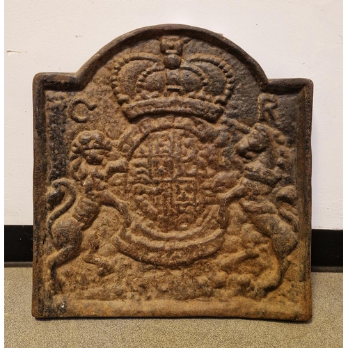 1030 - Large cast iron fireback depicting coat of arms of Charles I, measuring approx. 56cm high x 53cm wid... 