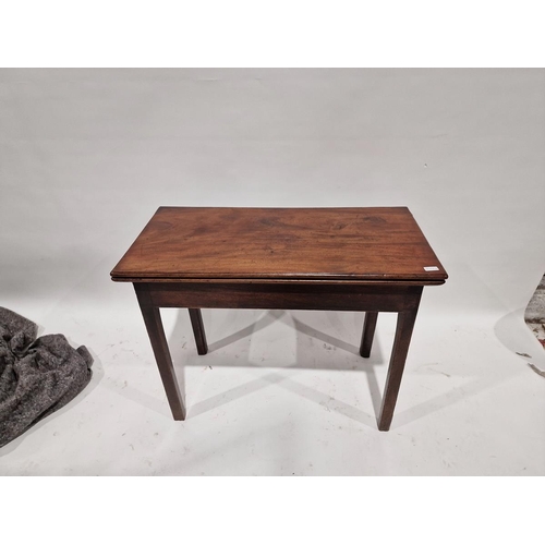 1031 - Georgian mahogany foldover tea table of rectangular form raised on square legs, approx. 72cm high x ... 