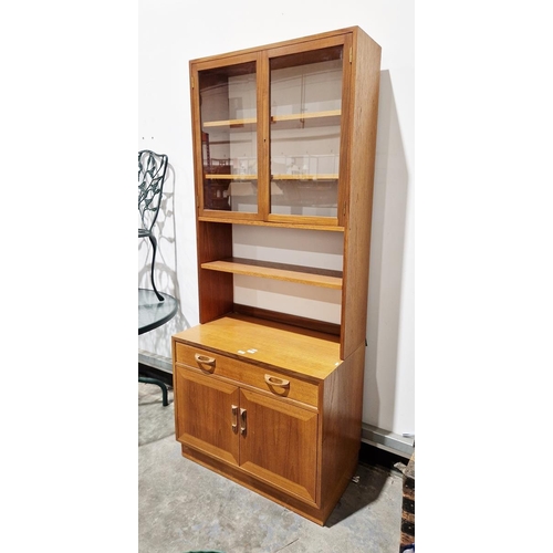 1060 - G Plan 'Sierra' range teak wall unit incorporating display cabinet, open shelves and cupboard base, ... 