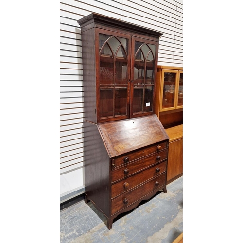 1064 - Victorian mahogany bureau bookcase, the top section having two glazed panels opening to reveal two a... 