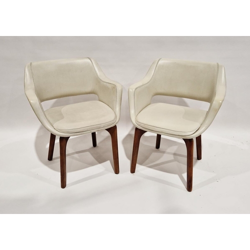 1068A - Pair of cream leather look 20th century Australian chairs, on teak curved cross framed legs, labelle... 