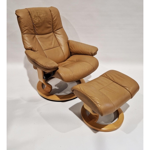 1191 - Stressless Ekornes reclining armchair and footstool, upholstered in beige leather, on circular suppo... 