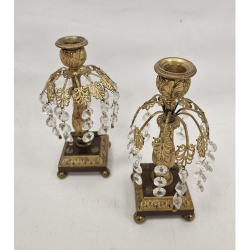 120 - Pair of 19th century gilt-metal and cut glass lustre candlesticks, with foliate sconces, on baluster... 