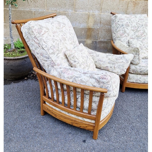 1213 - 20th century oak three-piece sofa suite by Ercol, design no.1154, comprising a three-seater sofa and... 