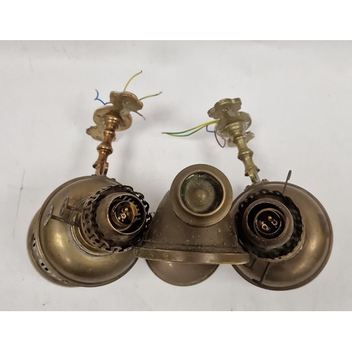 125 - Two brass pierced cylindrical wall-mounted oil lamps, the first pierced with fretwork on baluster su... 