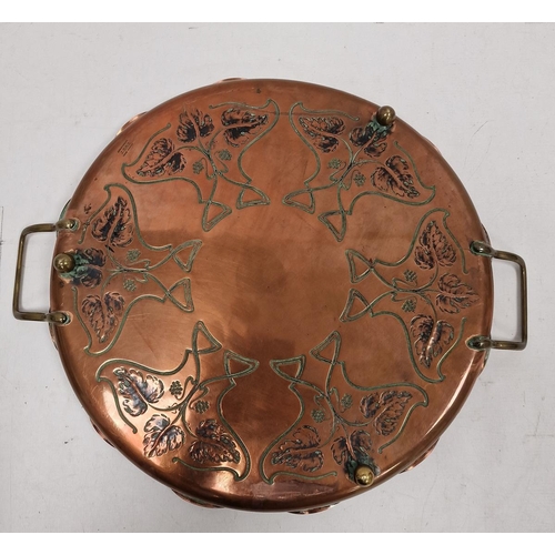 134 - J.S & S Art Nouveau copper two-handled circular tray, cast with fruiting vine and whiplash motifs, r... 