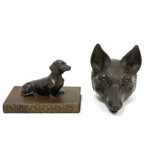 173 - Cast iron doorstop in the form of a fox head, probably late 19th century, 16.5cm long and a bronze-e... 