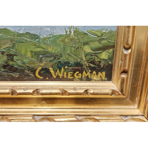 357 - C Wiegman 
 Oil on canvas
 River landscape with bridge and half timbered buildings, signed lower rig... 