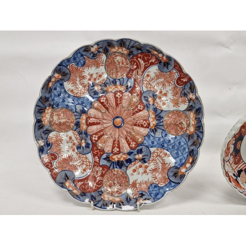 93 - Late 19th century Japanese Imari fluted circular dish, decorated with a central mon flanked by terra... 