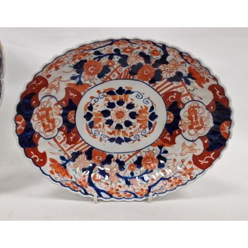 93 - Late 19th century Japanese Imari fluted circular dish, decorated with a central mon flanked by terra... 