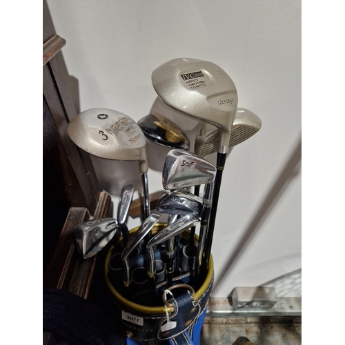 432 - Set of golf clubs within carry bag, the clubs are marked 'Wilson'