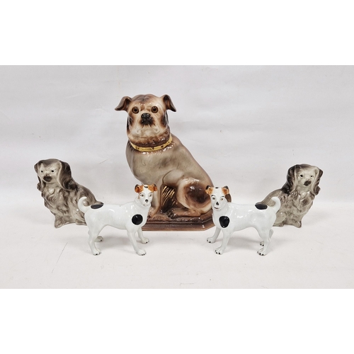 11 - Pair of late 19th century Staffordshire pottery models of terriers with black and white patches, eac... 