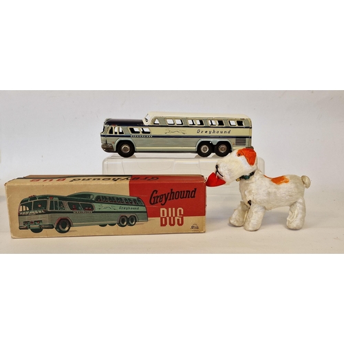 506 - Stone, Japan tinplate Scenicruiser Greyhound bus in blue and white, boxed, and a clockwork orange an... 