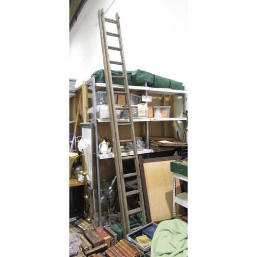 1295 - Two part wooden extending ladder, each section approx. 3.5m long