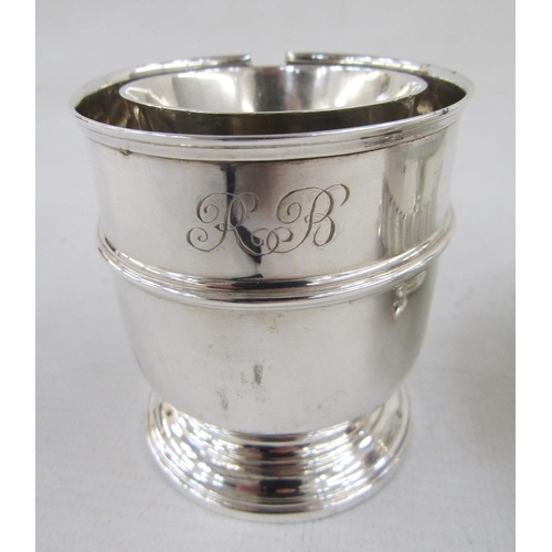 115 - Silver parcel-gilt whisky tot of inverse bell-shape, a footed condiment pot, Birmingham assay and a ... 