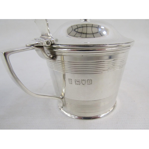 122 - George V Silver engraved armorial mustard pot and two salt cellars, each of cylindrical form with re... 