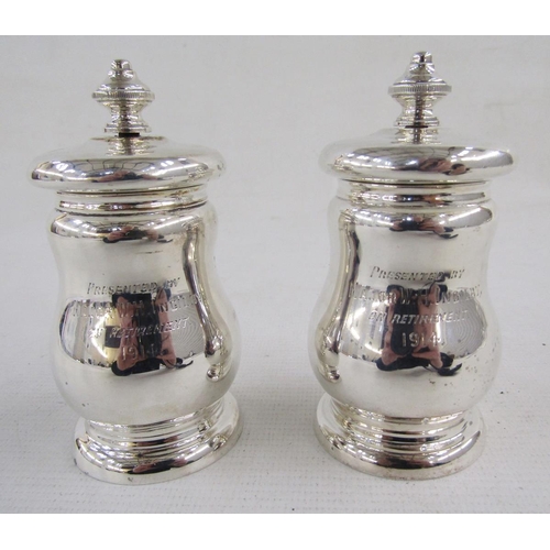 123 - Pair of 20th century silver armorial salt and pepper grinders, each of baluster form, engraved with ... 