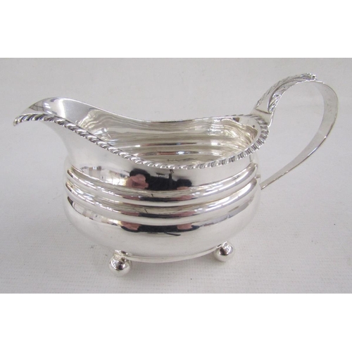 125 - George IV silver milk-jug, of oval form with gadrooned rim and leaf terminal, raised on ball feet, h... 