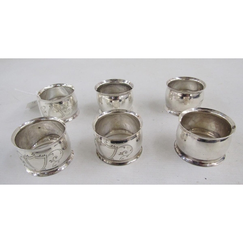 151A - Cased set of six Edwardian engraved silver-plated napkin rings, each engraved with a shield-shape es... 