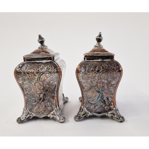 155 - A pair of early Sheffield plate tea caddies, c 1750, with embossed foliate design, on four ball feet... 