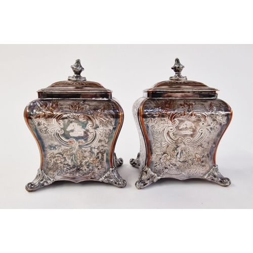 155 - A pair of early Sheffield plate tea caddies, c 1750, with embossed foliate design, on four ball feet... 