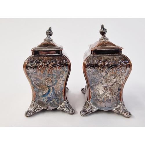 155 - A pair of early Sheffield plate tea caddies, c 1750, with embossed foliate design, on four ball feet... 