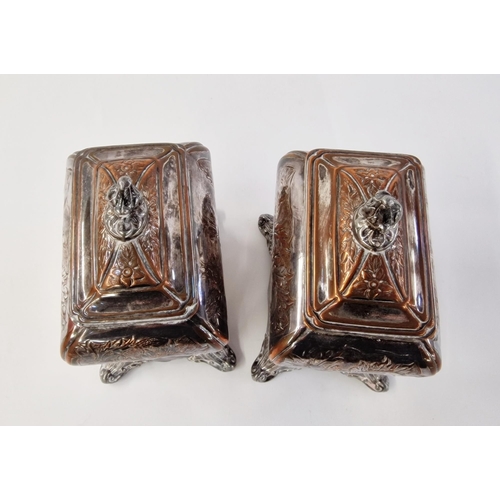 155 - A pair of early Sheffield plate tea caddies, c 1750, with embossed foliate design, on four ball feet... 