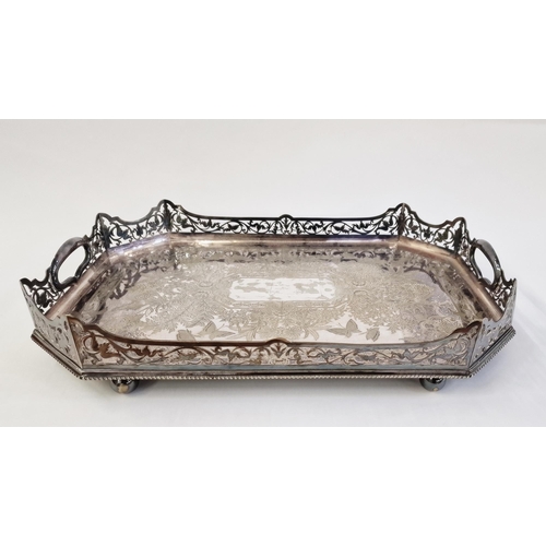 157 - A large silver plated and engraved tray with a pierced gallery, elaborate engraved floral decoration... 