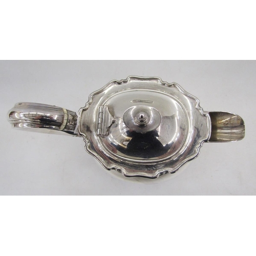 17 - George V silver teapot, raised on four bun style feet, hallmarked Sheffield 1929, by Atkin Brothers,... 