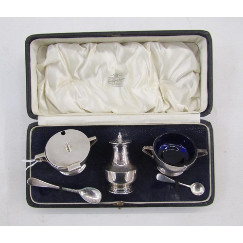 19 - George V Art Deco silver condiment set, comprising lidded mustard, open salt and pepper pot, with on... 