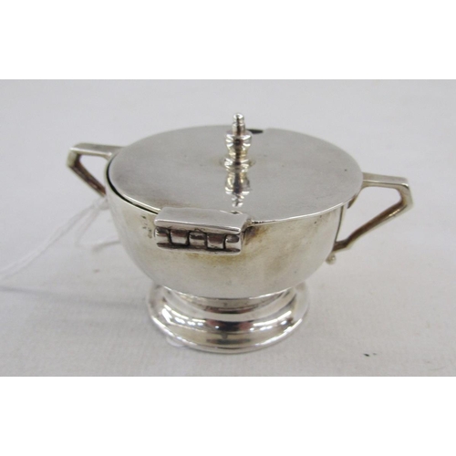 19 - George V Art Deco silver condiment set, comprising lidded mustard, open salt and pepper pot, with on... 