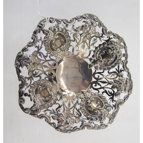 23 - Early George V silver trinket stand, circular with pierced repousse top on flared circular base