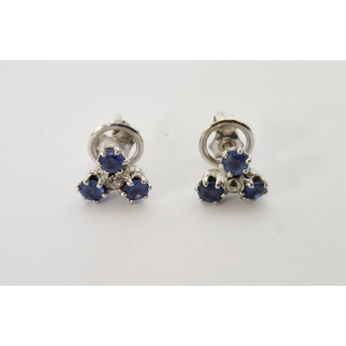 240 - Pair of sapphire and diamond trefoil pattern earrings, three sapphires and single diamond to the cen... 