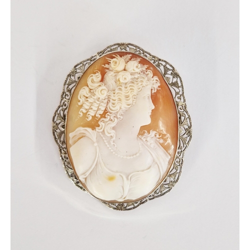 286 - White metal cameo brooch, the oval carved cameo depicting girl with flowers in her hair, and wearing... 