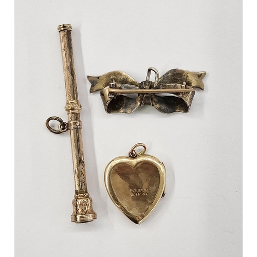 290 - Gold-coloured heart-shaped locket, a silver and green enamel ribbon badge, and a gilt metal propelli... 