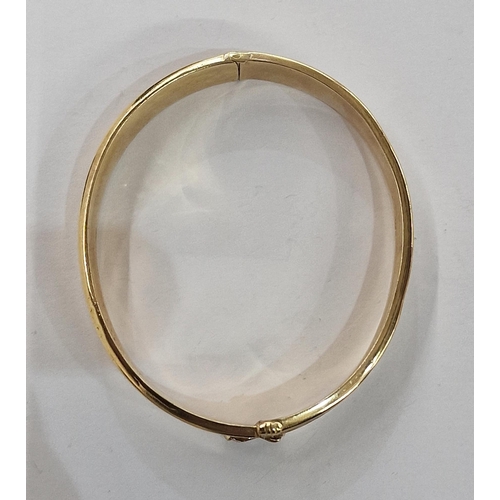 292 - 9ct gold bangle, slightly concave sides and fern engraved on a matted ground, 12.7g approx.