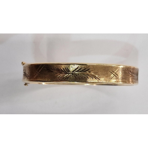 292 - 9ct gold bangle, slightly concave sides and fern engraved on a matted ground, 12.7g approx.