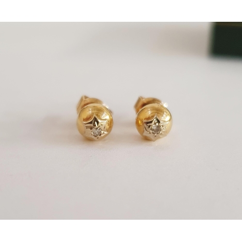 318 - Pair 18ct gold and diamond stud earrings, each spherical and set single diamond