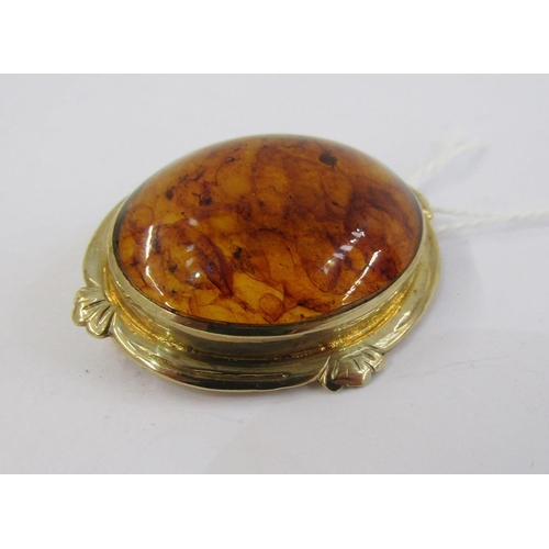 335 - Amber brooch, oval and having 9ct gold hallmarked surround and a white metal and white stone bar bro... 