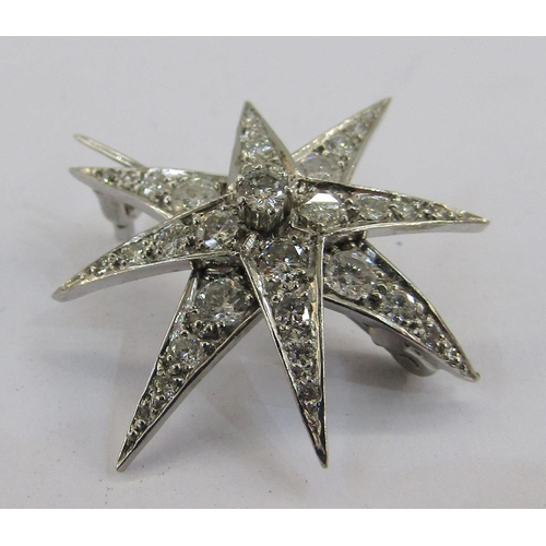 337 - 18ct white gold and diamond star brooch, eight-pointed, marker JHL, 3cm diameter, London 1977