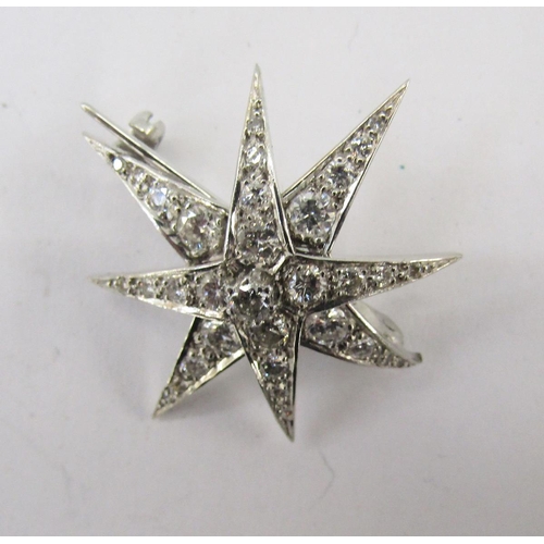 337 - 18ct white gold and diamond star brooch, eight-pointed, marker JHL, 3cm diameter, London 1977