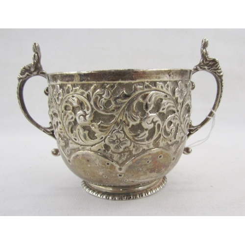 34 - Late Victorian silver twin handled sugar box, with repousse scrolling acanthus leaf decoration throu... 