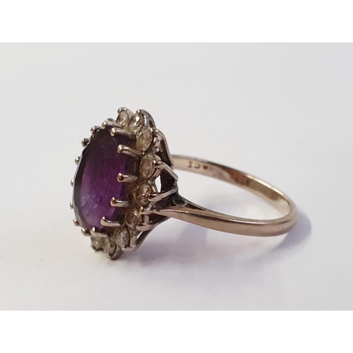 348 - 18ct white gold, amethyst and diamond cluster ring set centre facet-cut oval amethyst and having sur... 