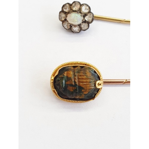 355 - Gold stick pin, the terminal in the form of simulated scarab beetle, and another with opal and diamo... 